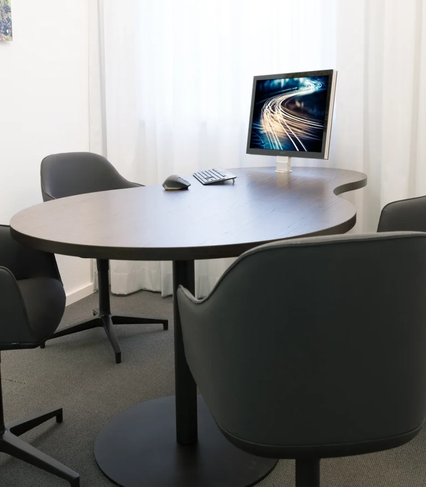 Desk-mounted display for a consultation room