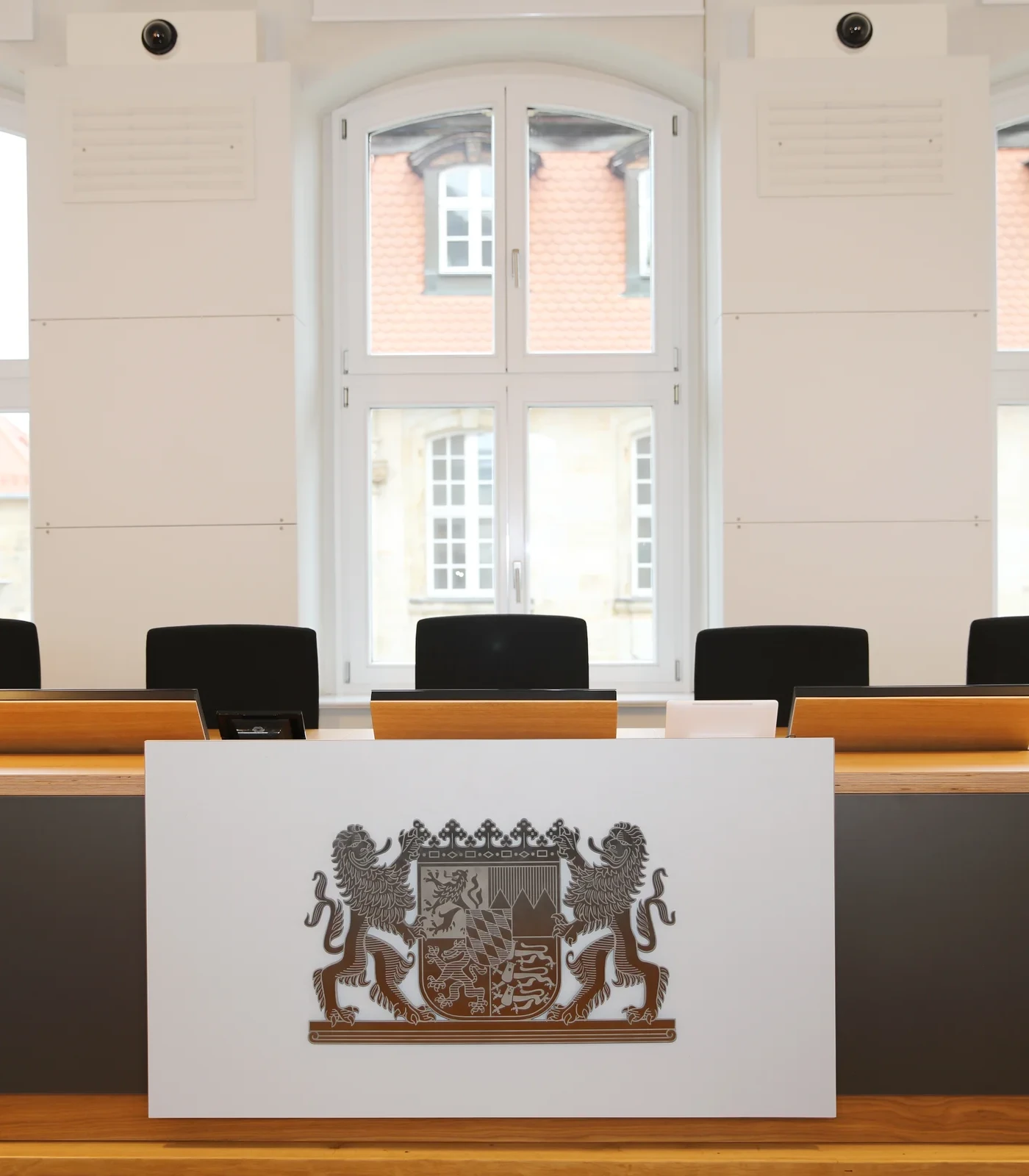 Retractable LOFT fold monitor from NOVIS integrated into courtroom table
