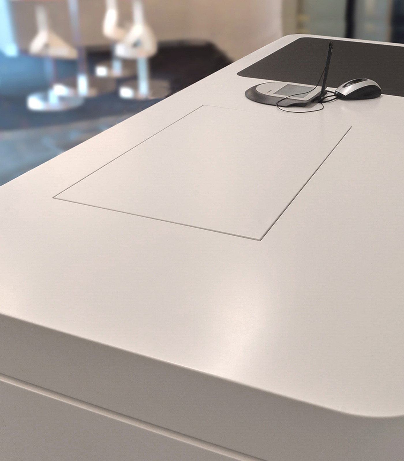 Invisibly integrated LOFT fold table-mounted monitor from NOVIS in a service counter