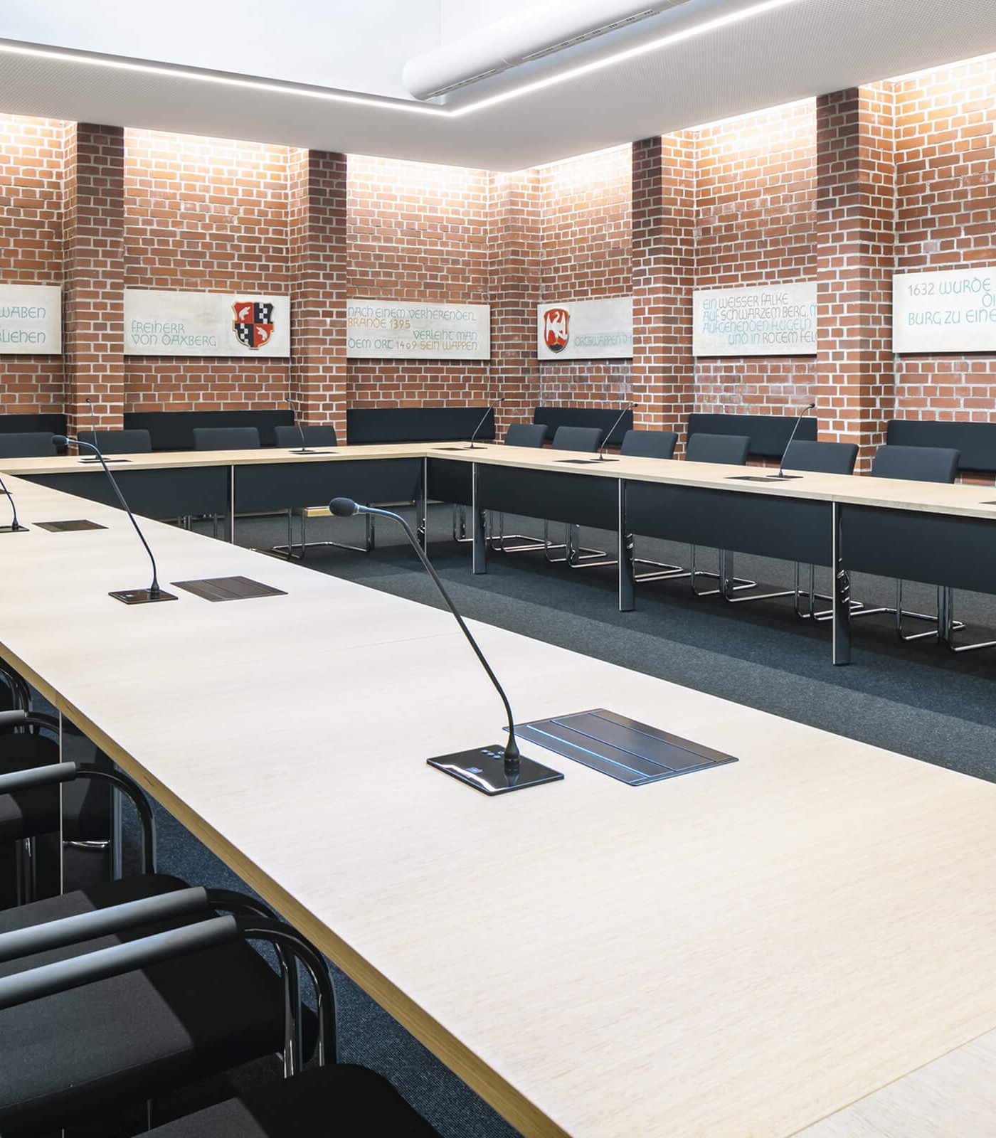 Town hall with retractable monitors