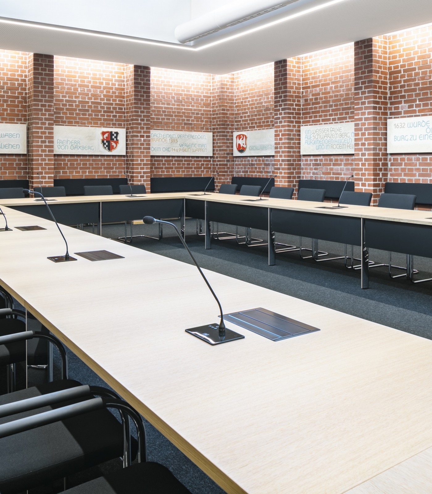 A invisible monitor integration into a conference table of a town hall