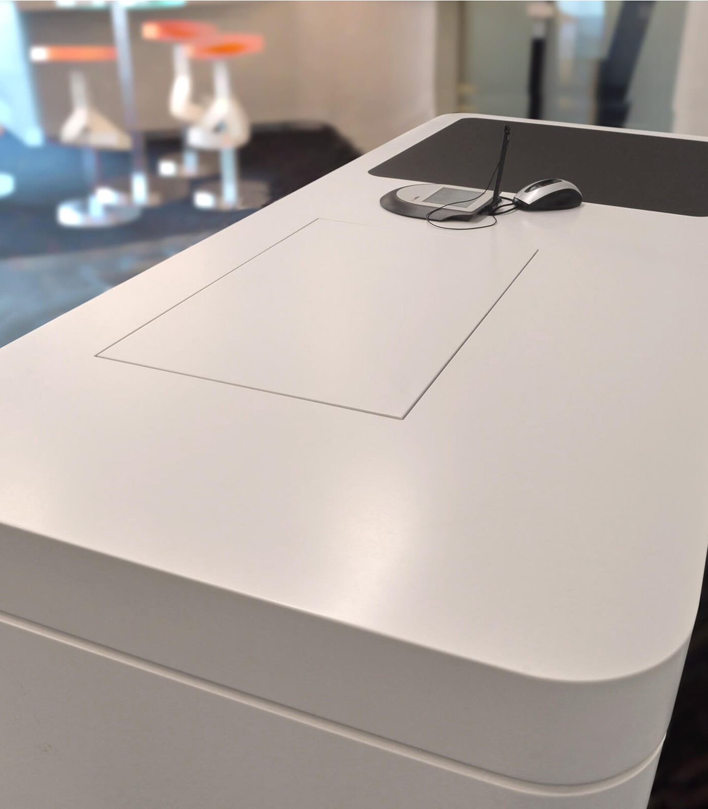 cosed retractable monitor in a counter desk everything the same surfaces