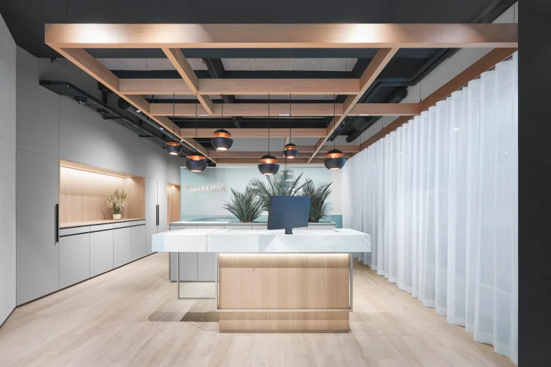 LOFT desktop integrated design monitor in a modern bank interior