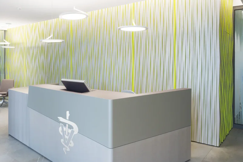A reception desk in a veterinary clinic. Our retractable LOFT fold monitor fits seamlessly into the desk